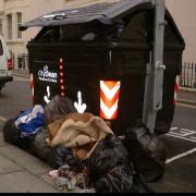 BIN LADEN: An overflowing communal bin