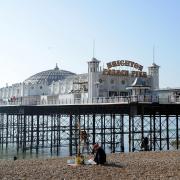 Part of Brighton beach near the Palace Pier has been evacuated following reports that a shell from the Second World War has washed ashore