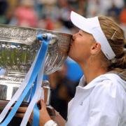 Caroline Wozniacki kisses the trophy after beating Virginie Razzano in the final (photos Simon Dack)