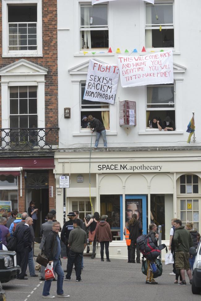 Squatters in property above Brighton centre shop call police after eviction attempt