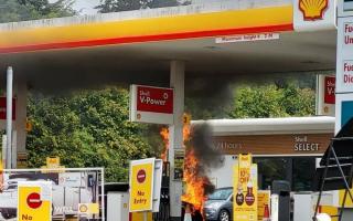 Firefighters are working to tackle the blaze at the petrol station in Fontwell