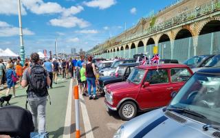 People enjoying the London to Brighton mini car run in Madeira Drive