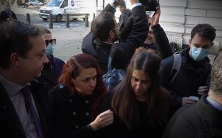 Hanin Barghouthi, centre right, entering Westminster Magistrates' Court while a supporter blocks a photographer from taking a picture