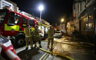 A pub was evacuated as firefighters dealt with a blaze at a nearby flat this evening
