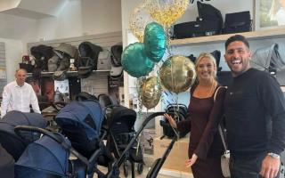 Ahmed Shaker and his partner Emily Blunden, right, are among the parents-to-be who have been left out of pocket by the business. Pictured here in the shop after making their purchase