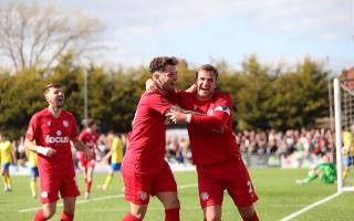 Worthing celebrate their final goal against Weston-super-Mare - in front of packed terraces