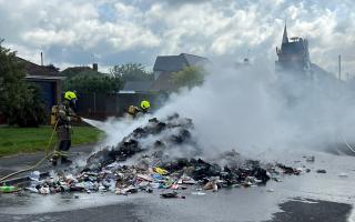 Road closed as firefighters tackle blaze