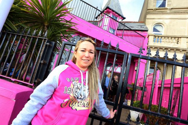 Alexandra Capone outside her house in Marine Parade, Worthing, when it was painted pink.