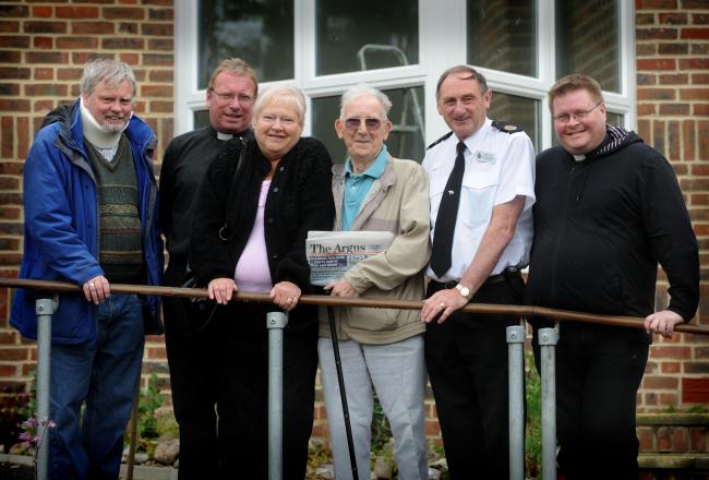 Father James Wesson (second from left) with members of his Brighton congregation.