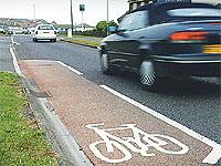 A car gives the four-metre-long cycle path a wide berth