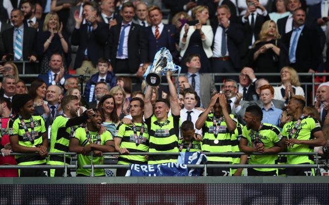 Izzy Brown (far left), celebrating promotion with Huddersfield, has been snapped up by Albion