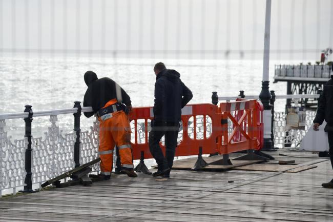 Workmen on Brighton Palace Pier after reports of a Forklift fell off the pier ..Picture Allan Hutchings.